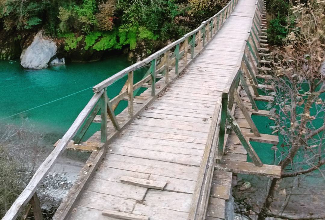 wooden bridge over a River in Himachal